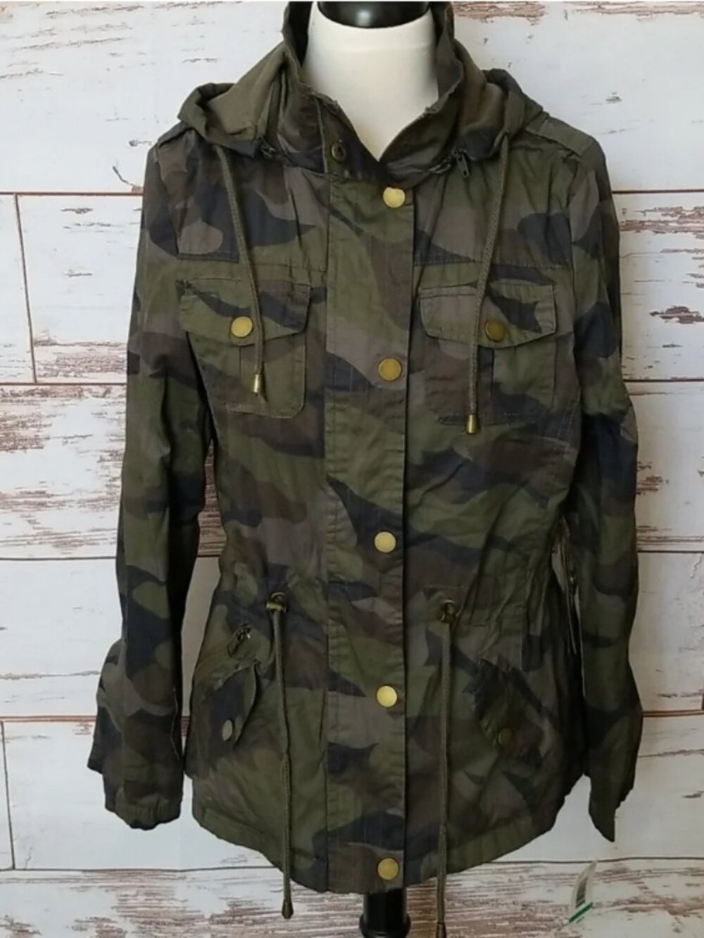 YMI camo jacket with adjustable draw string, pockets, and removable hood size L